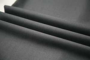 Charcoal-grey TR suiting fabric draped to show its finish