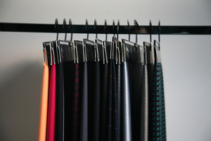 Rail of hanging Zhengda fabric samples in many colours